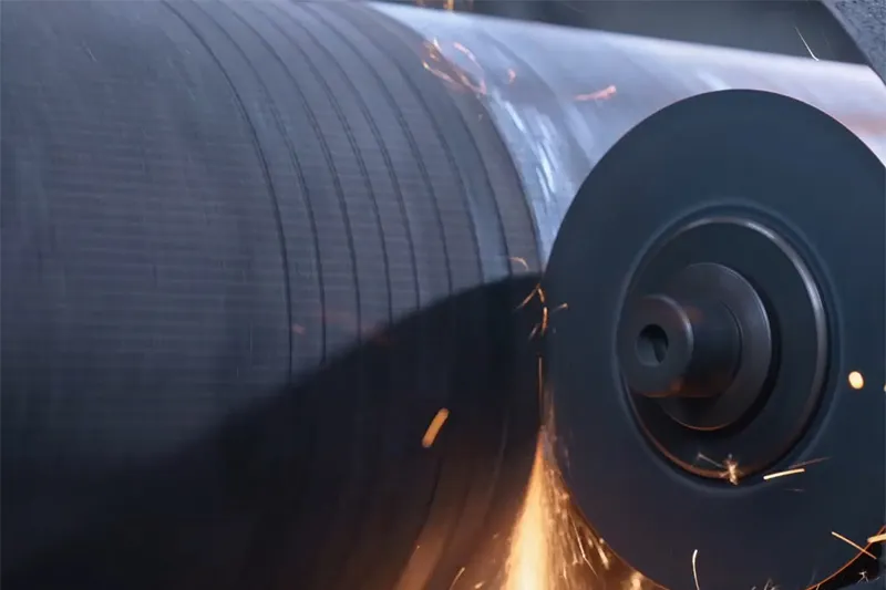 Corrugating roll suction slot cutting